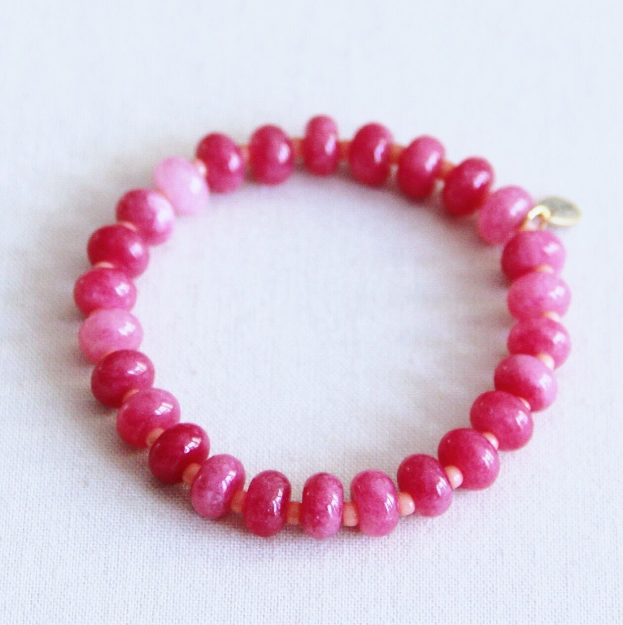 Bracciale elastico in pietre preziose - fucsia/rosa