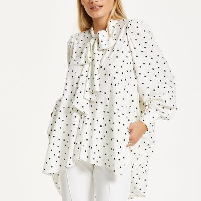 Blusa de lunares con volantes de corte alto y bajo