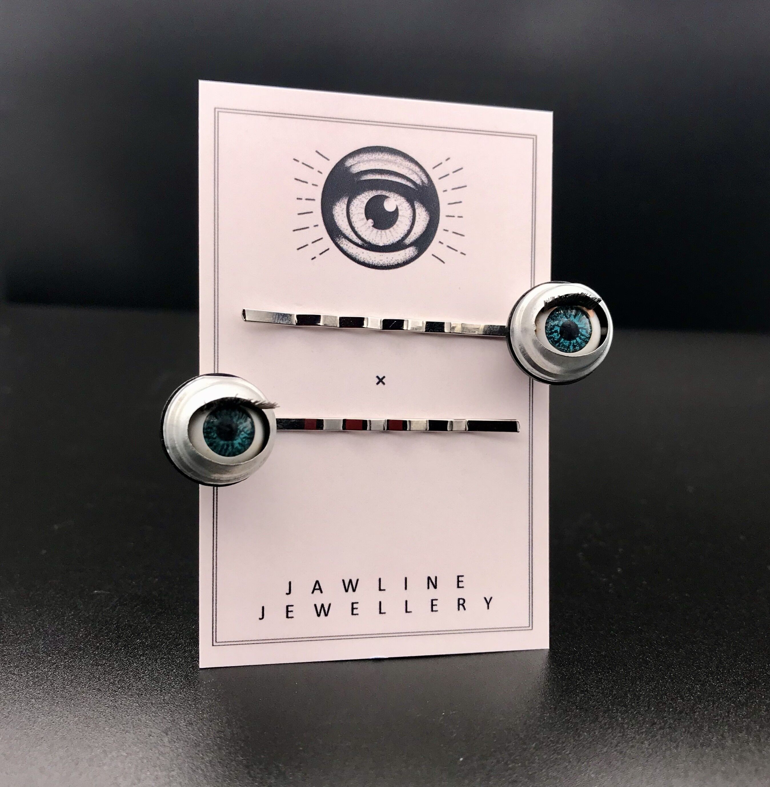 Pinces à cheveux yeux de poupée clignotants