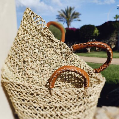 Openwork palm and bulrush basket with leather handles