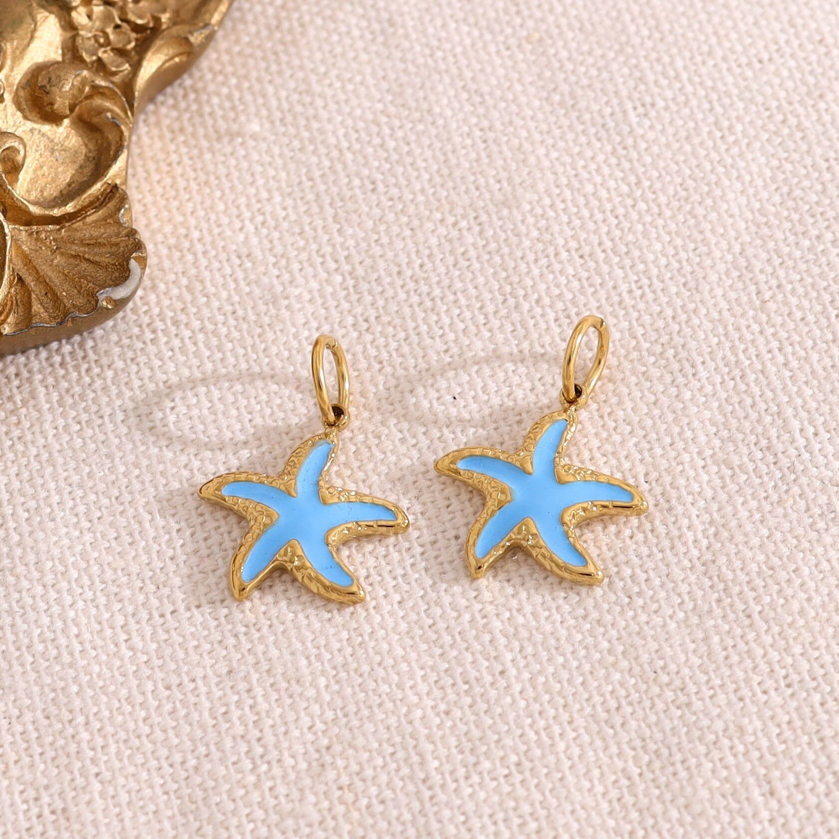 Set di 3 ciondoli a forma di stella marina blu