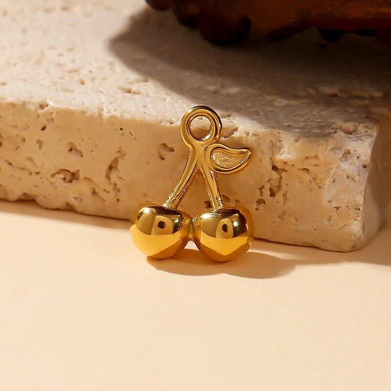 Set di 3 ciondoli a forma di ciliegia dorata