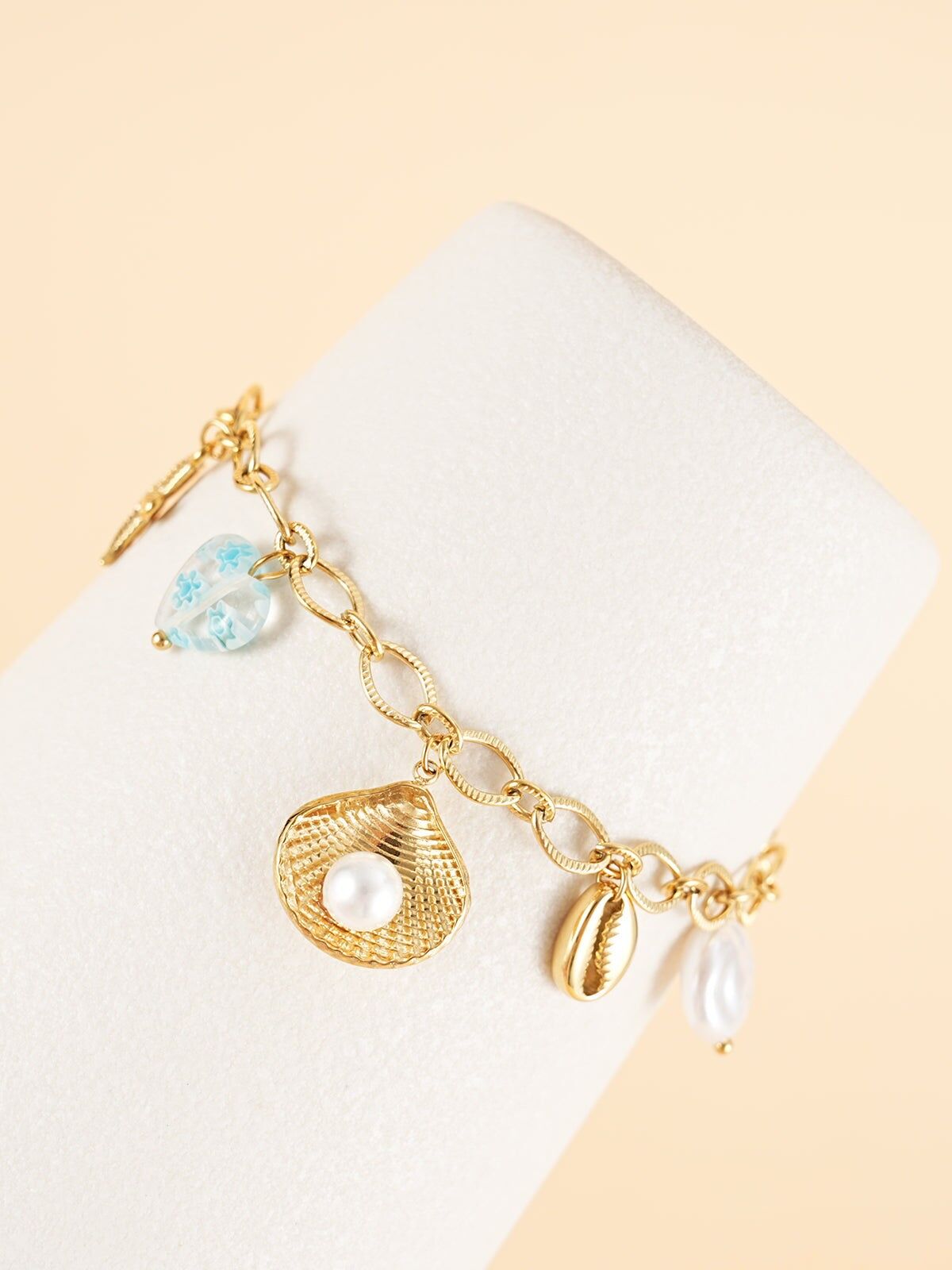 Bracciale a catena in oro con ciondoli a forma di mare blu