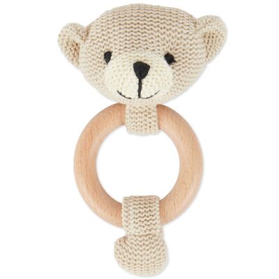 Grasping toy bear with rattle