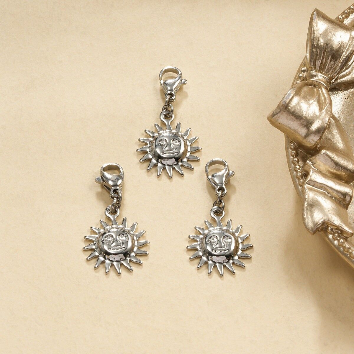 Set di 3 ciondoli in argento a forma di sole