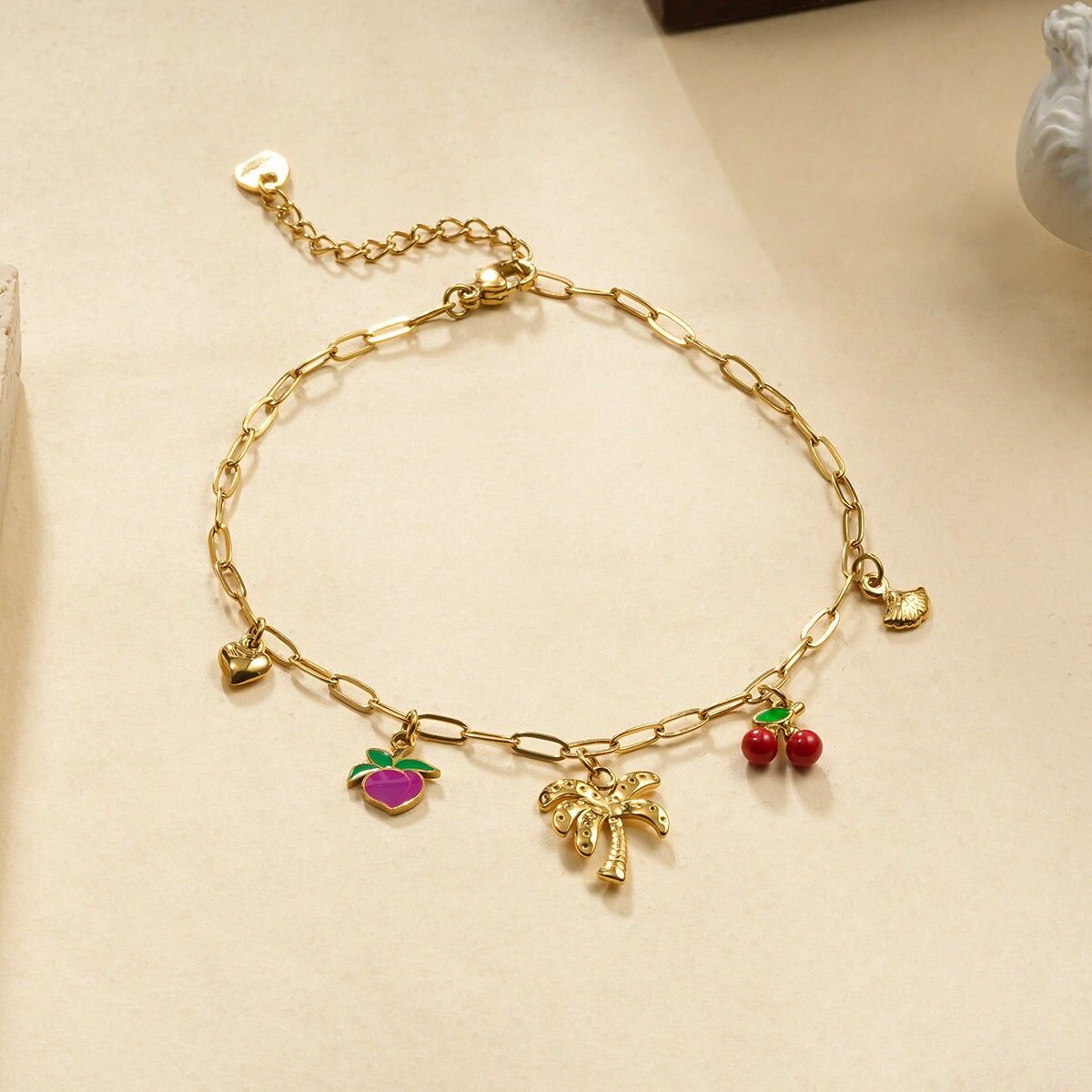 Cavigliera con 5 ciondoli a forma di palma e frutta