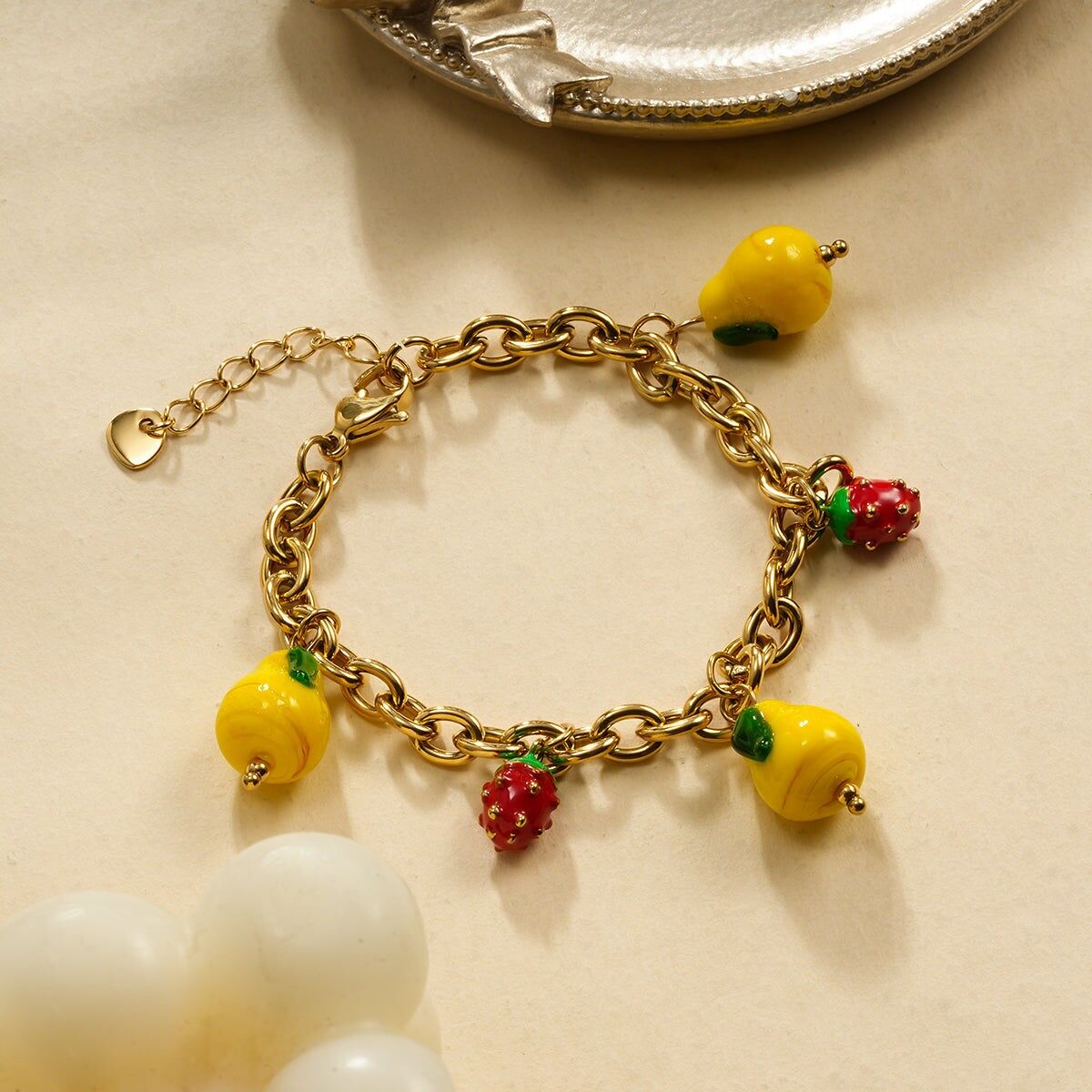 Bracciale a catena in oro con fragole e limone