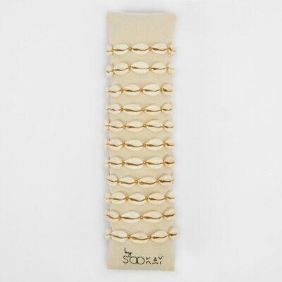 Pulsera de cauri natural reinterpretada: finos toques dorados
