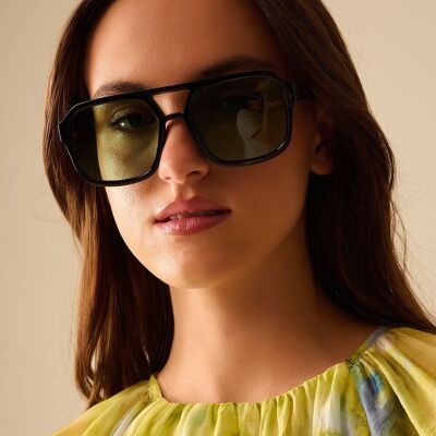Sunglasses with black frames and green lenses