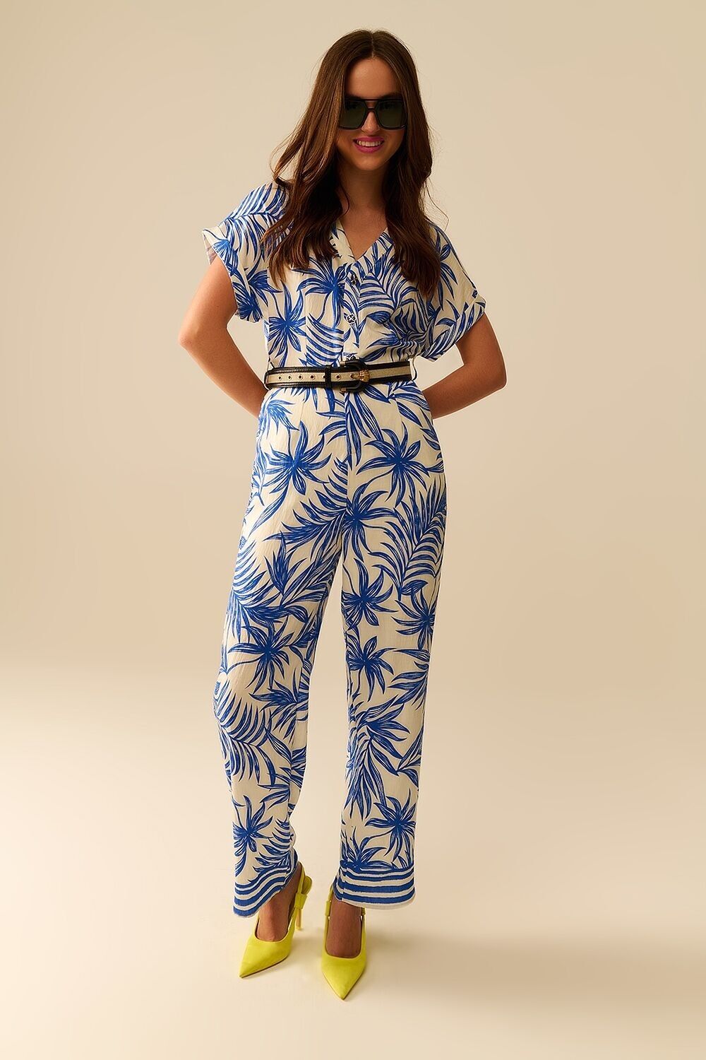 Tuta a maniche corte con motivo tropicale in blu e bianco