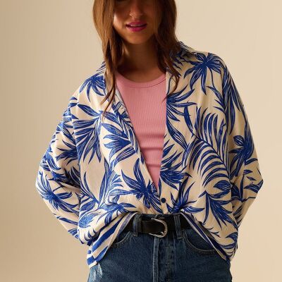 Blusa relajada con motivo tropical en azul y blanco