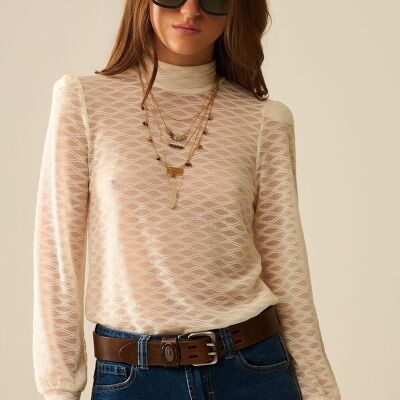 Top dolcevita in pizzo trasparente beige con spalle a sbuffo