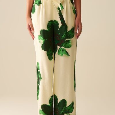 Pantaloni palazzo bianchi con stampa di fiori tropicali verdi e cintura abbinata