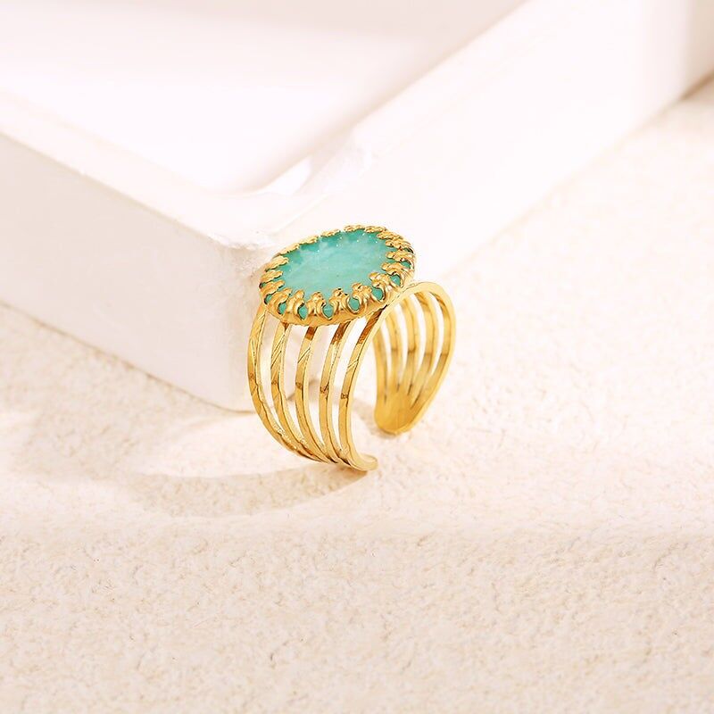 Anello multifilo in oro con artiglio in pietra blu