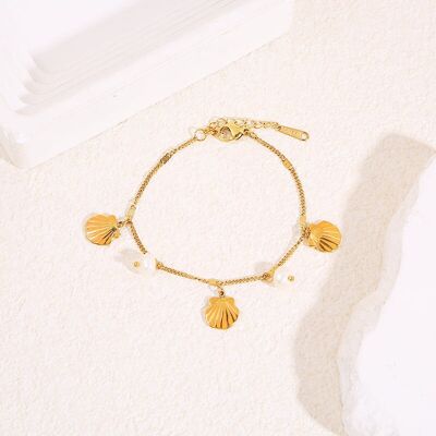 Fine gold chain bracelet with orange shell charms and pearls