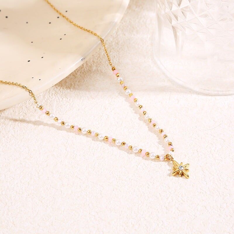 Goldene Halskette mit rosa Kristallen und Strass-Sternanhänger