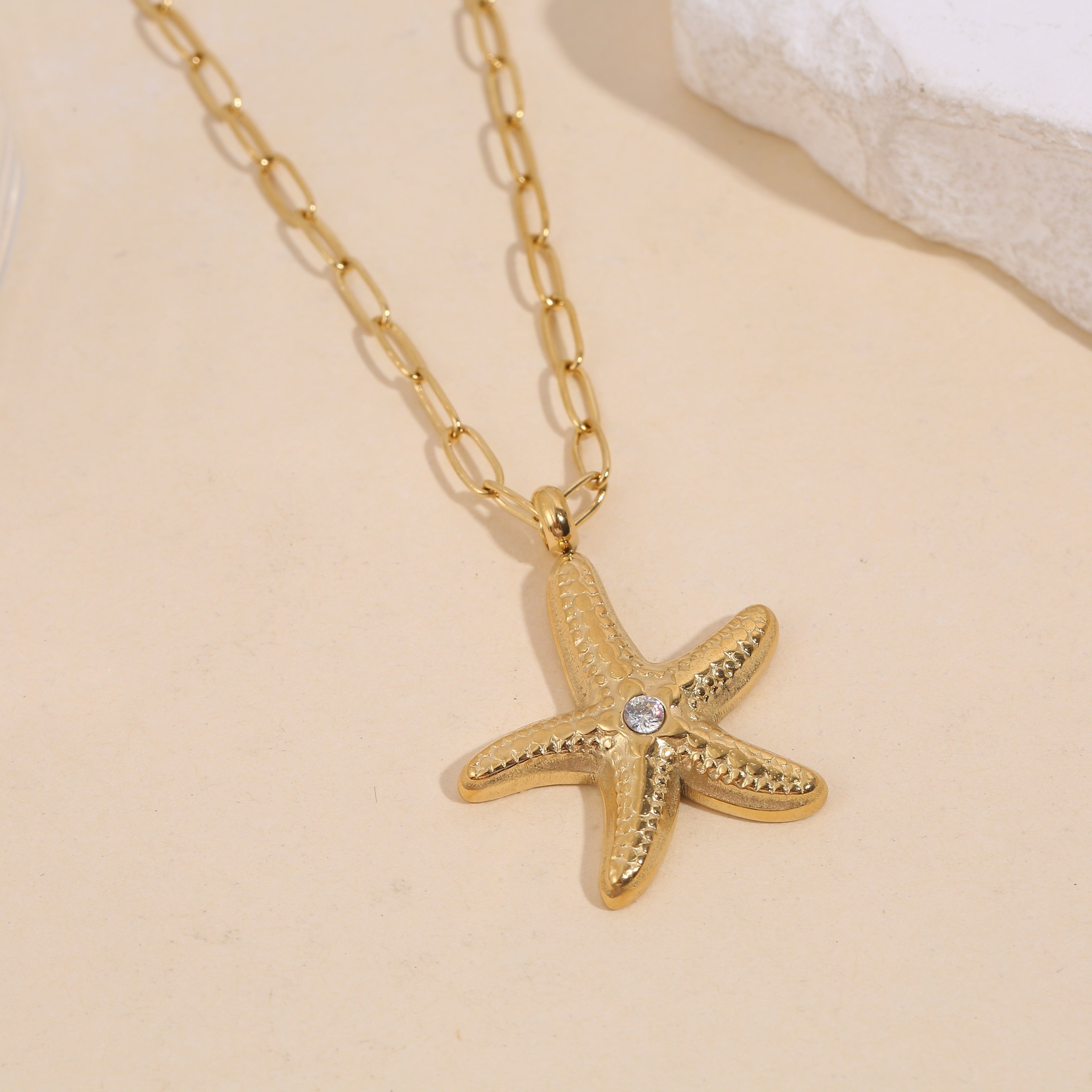 Goldkette mit Seesterngliedern und Strasssteinen