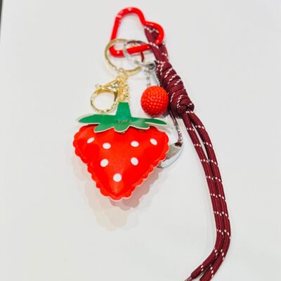 Red strawberry golf key ring accessory with braided cord