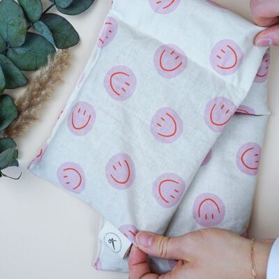 Cotton heat pad filled with organic spelt - Smiley Pink