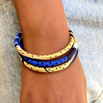 Pulseras de cera dorada, azul y negra