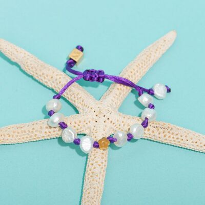 Pulseras de flores moradas del océano