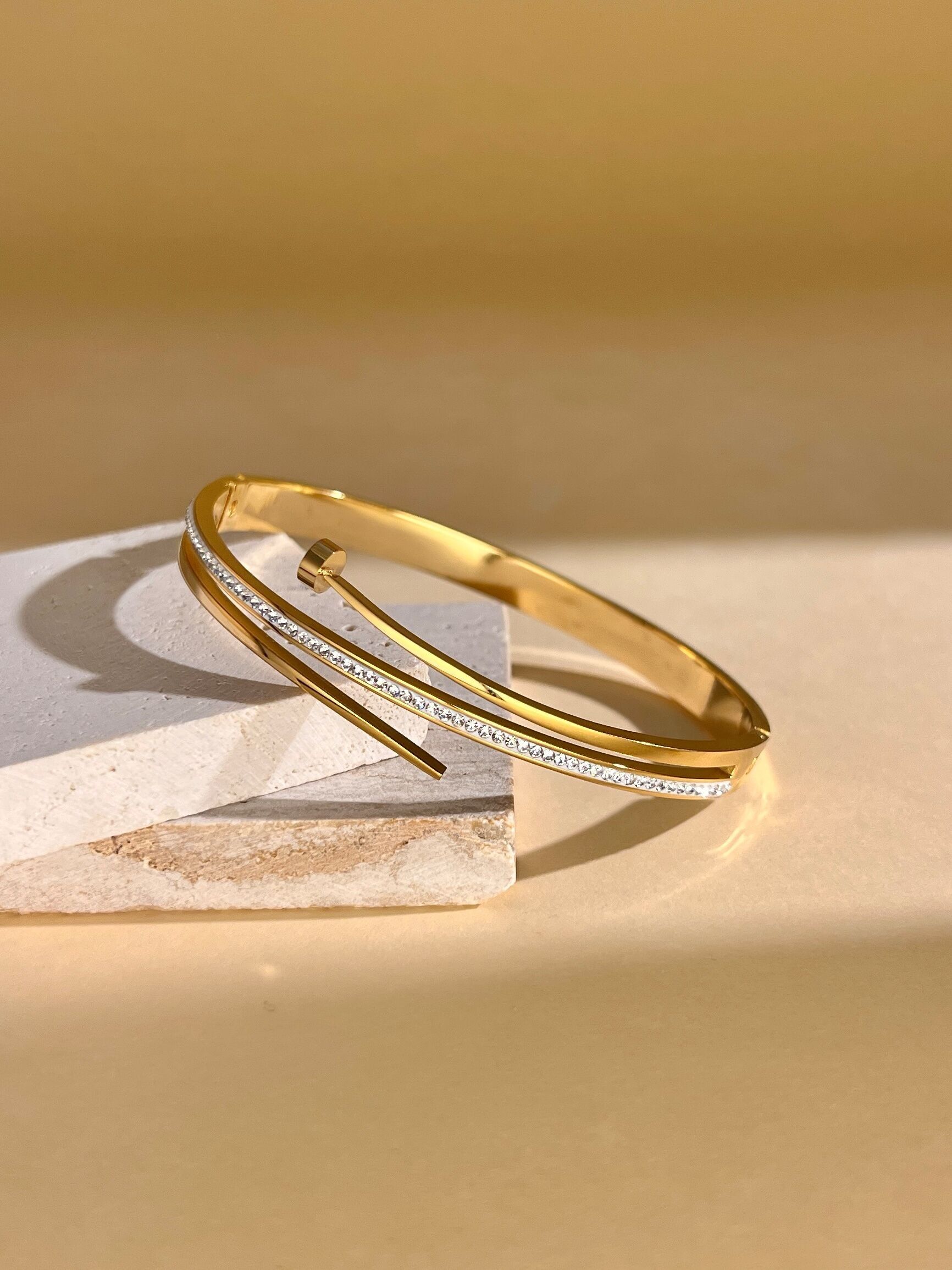 Stainless steel bangle bracelet in nail shape with rhinestones