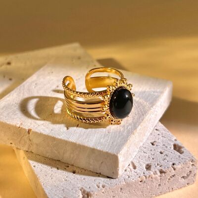 Stainless steel ring with central black oval stone and gold