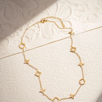 Collar de acero inoxidable dorado con motivos de flores y estrellas