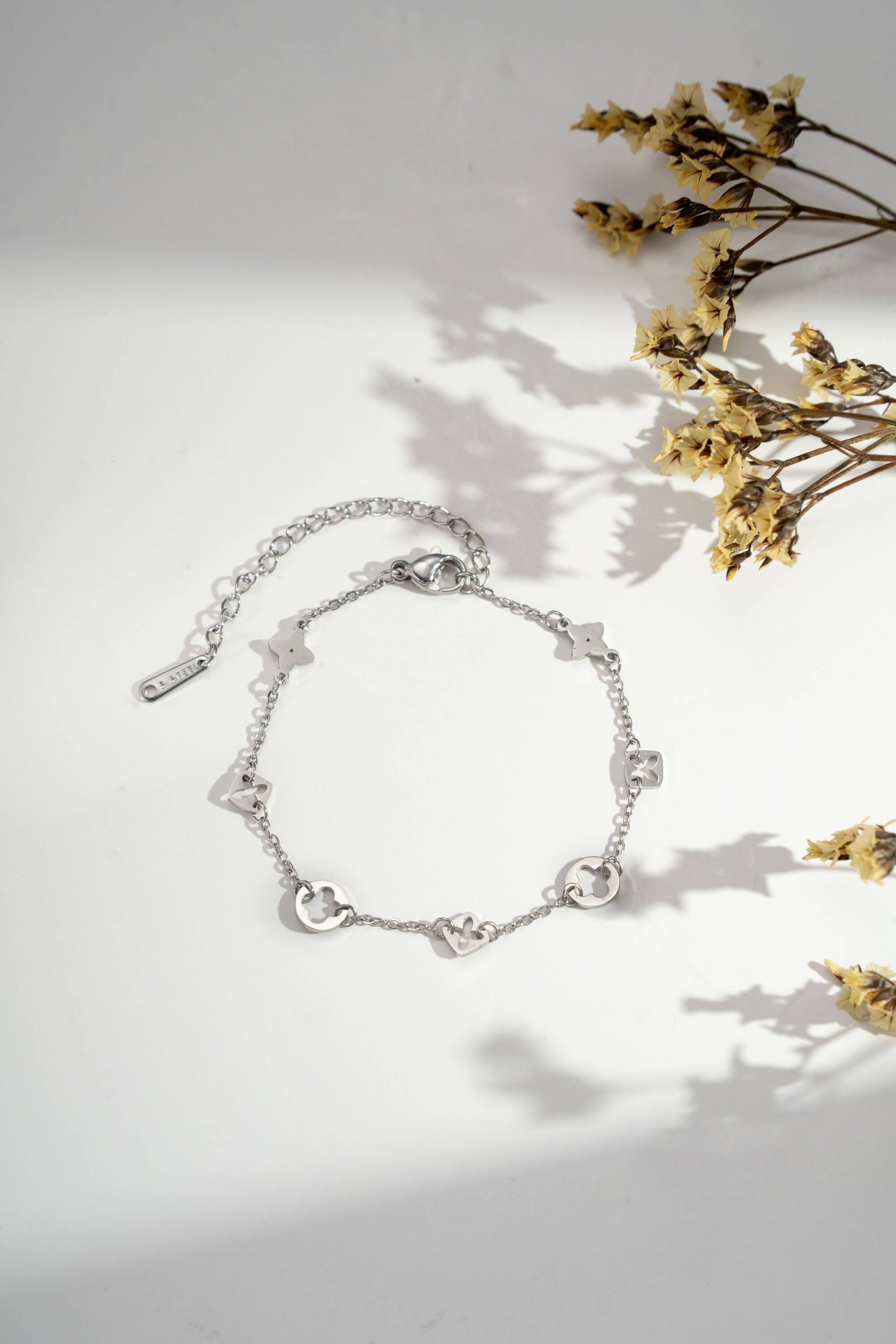 Bracelet with lucky star, moon, heart, clover steel pendants