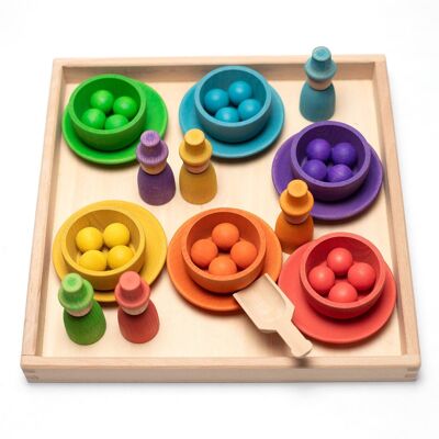 Wooden toys - Colored dolls, bowls and balls on a tray