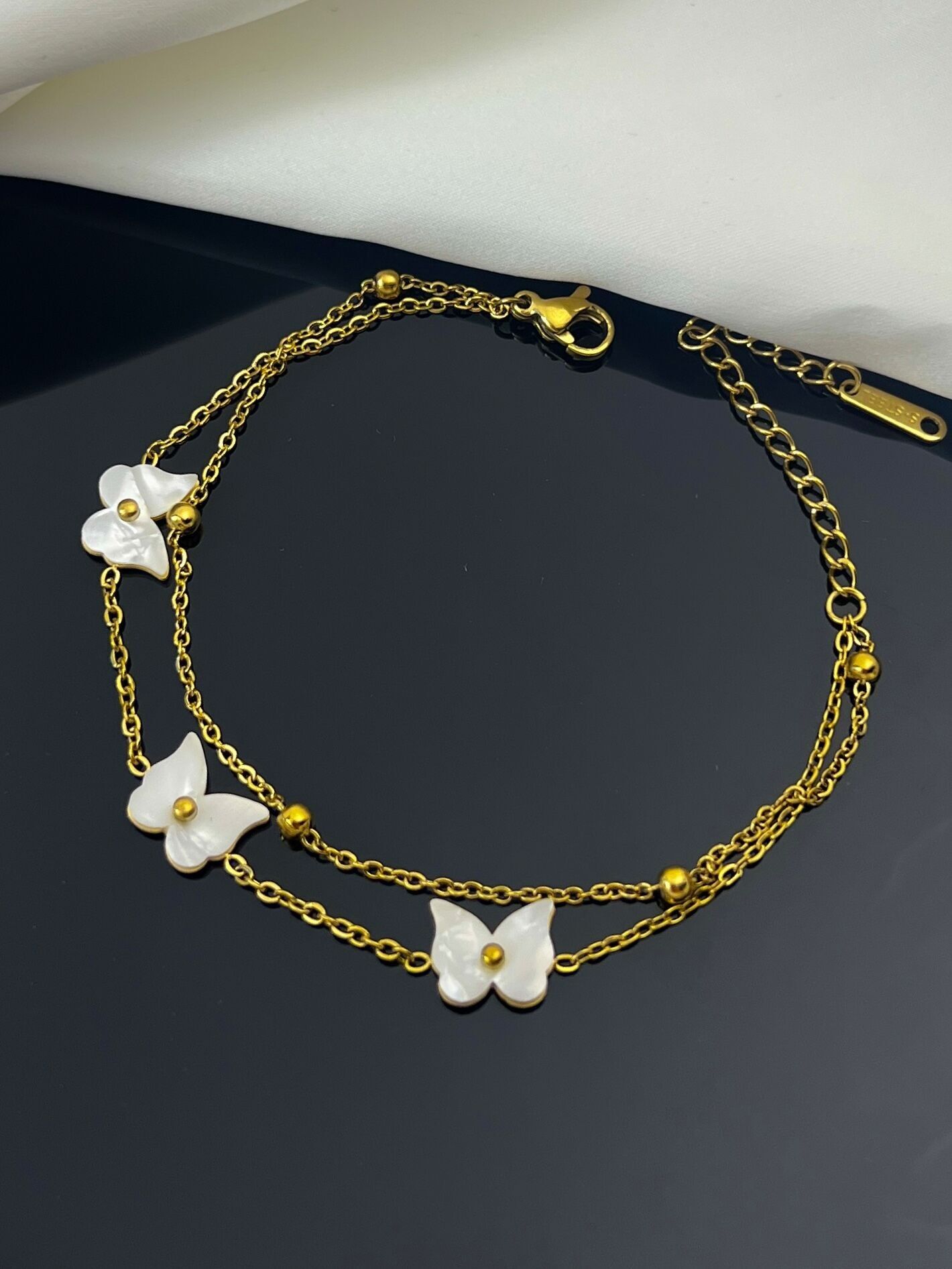 Pulsera de doble vuelta con motivo de mariposa de nácar en acero