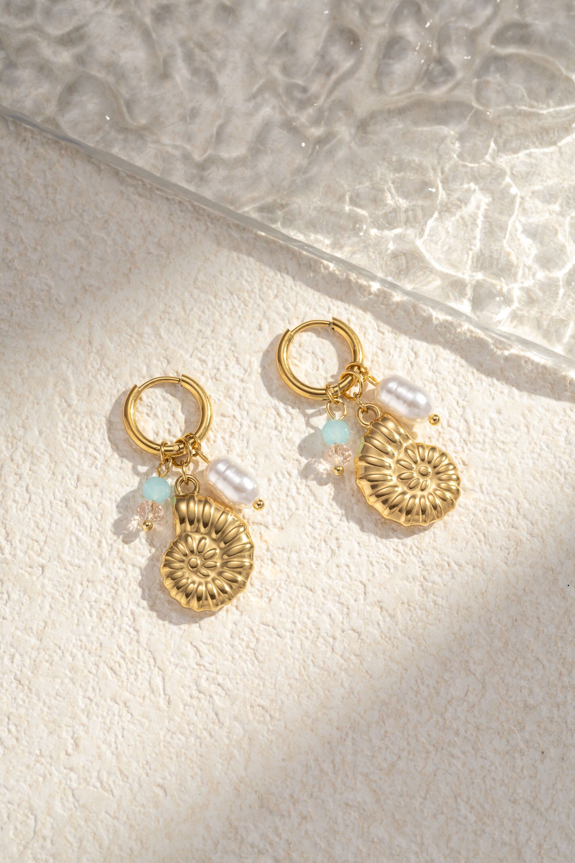 Stainless steel marine snail pendant earring