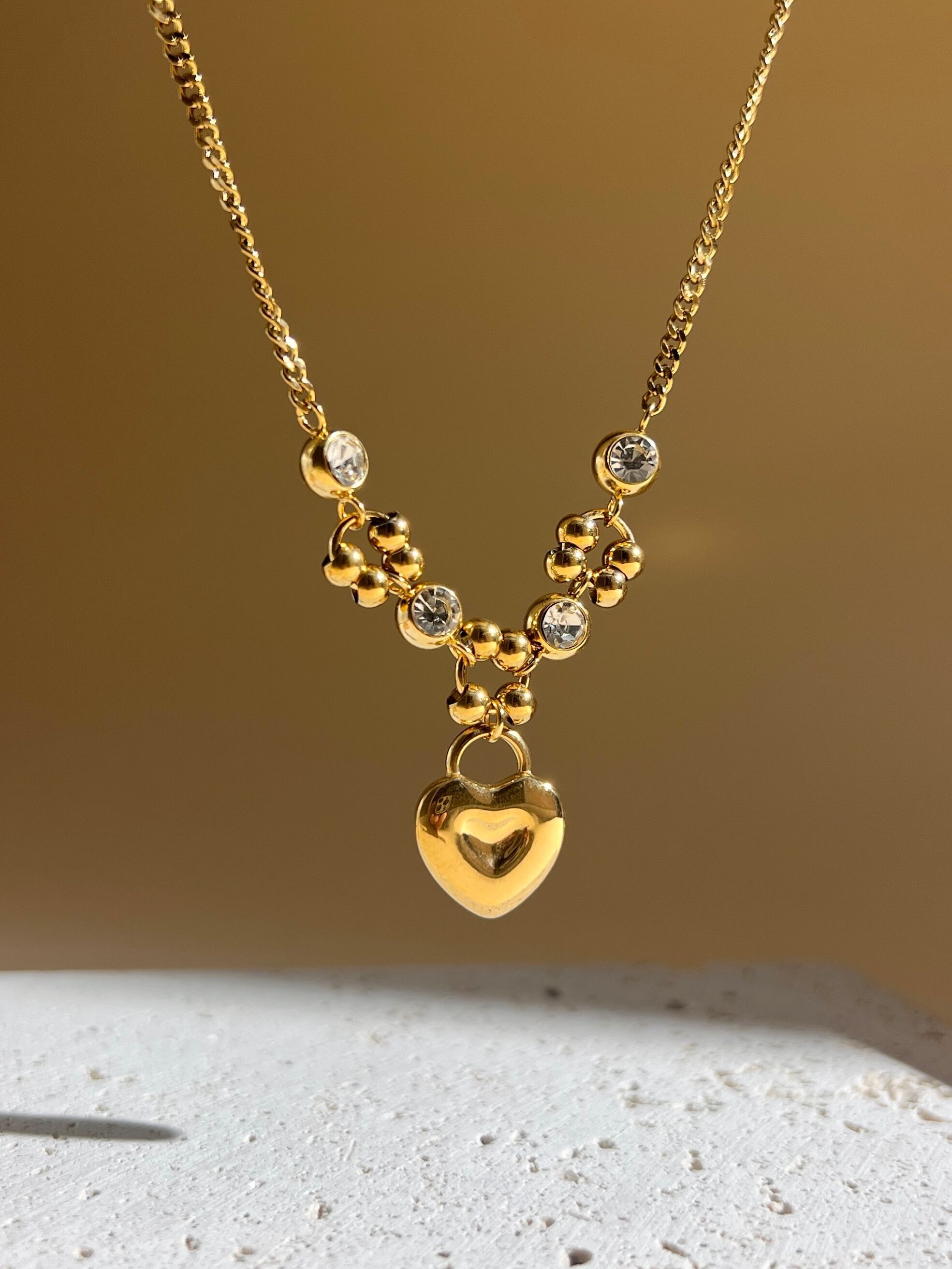 Stainless steel necklace with rhinestone heart pendant