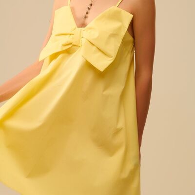 Mini-robe en popeline jaune avec un gros nœud
