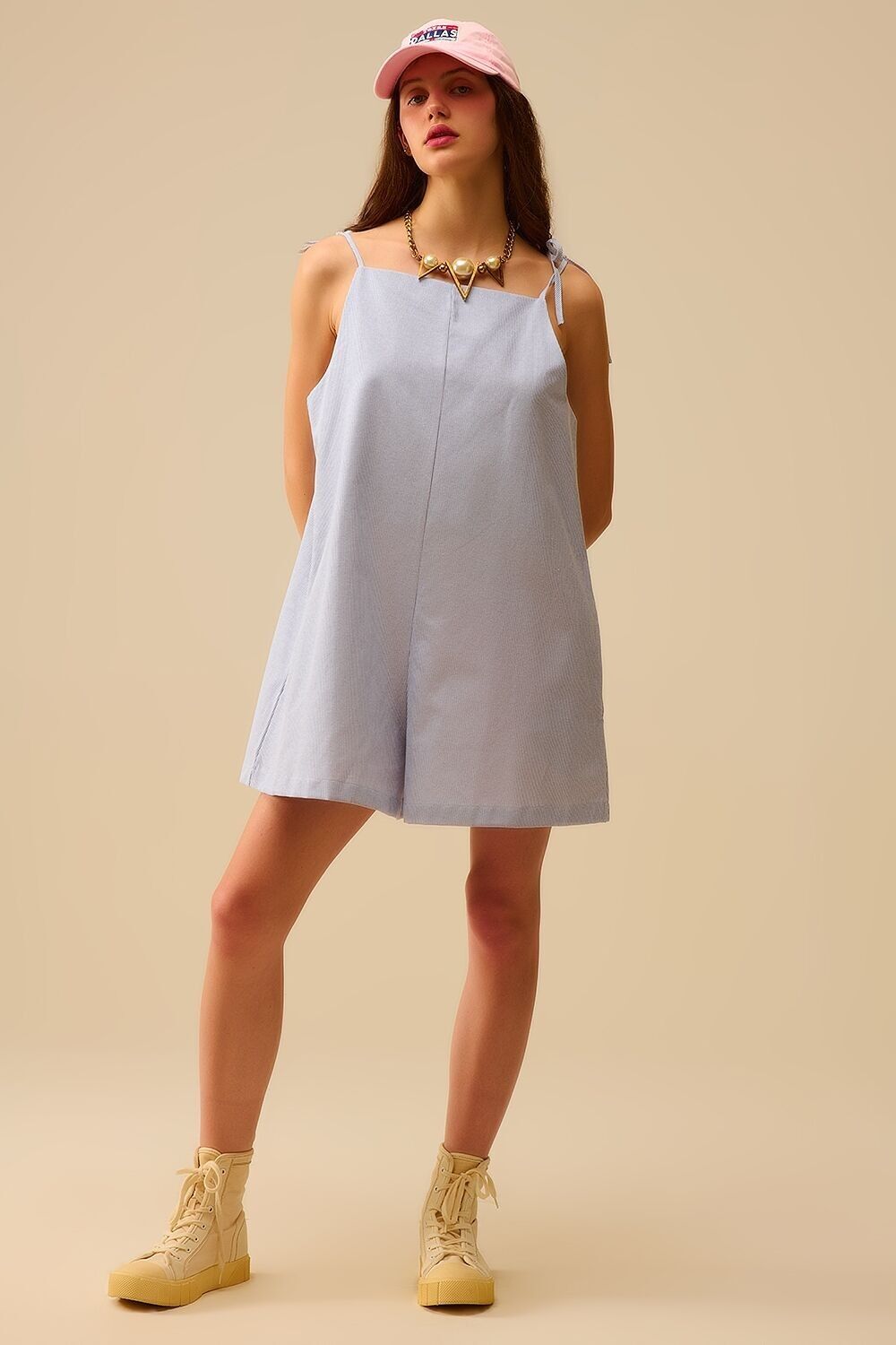 blue striped playsuit with shoulder ties and back pocket detail