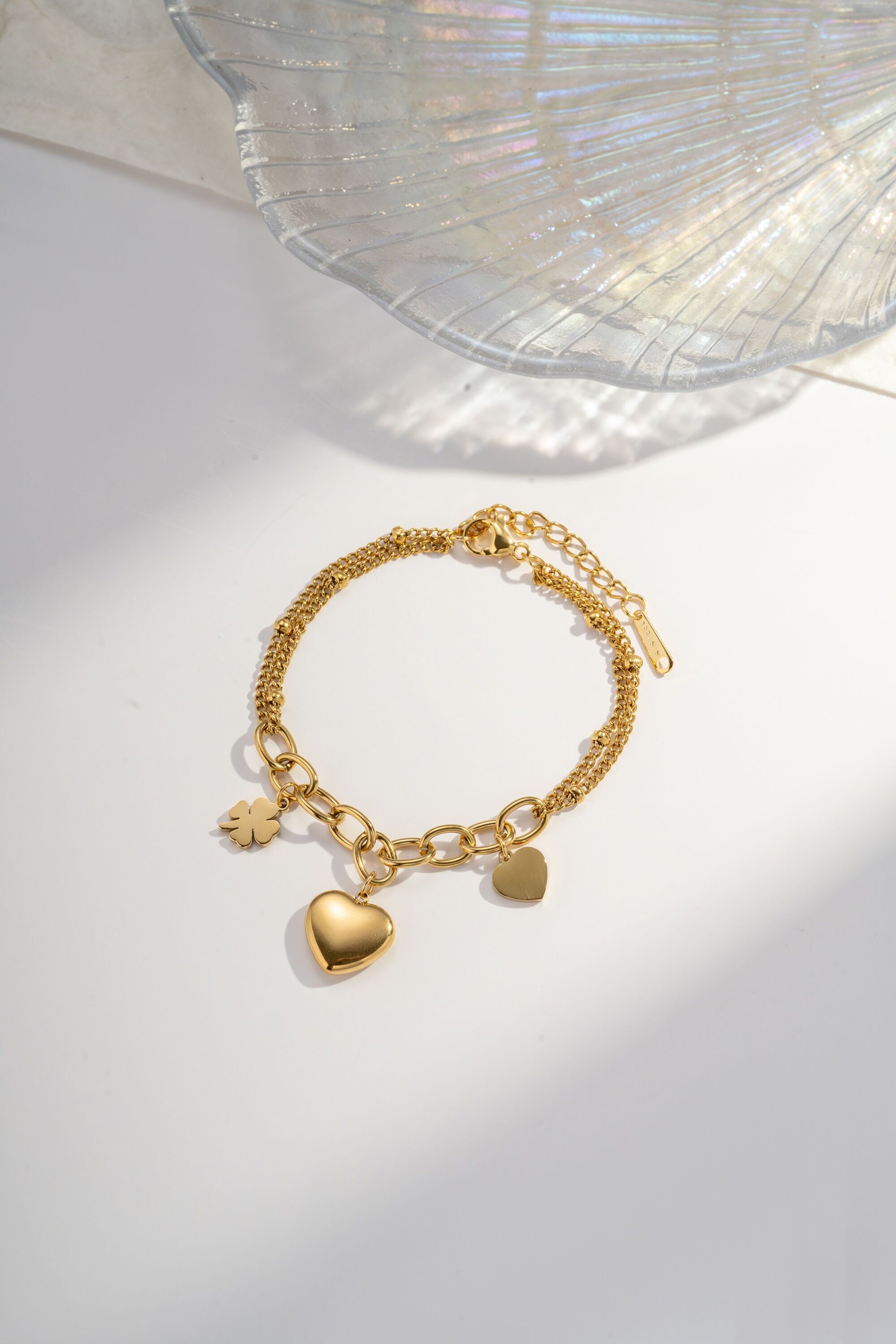 Stainless steel bracelet with heart and clover charms