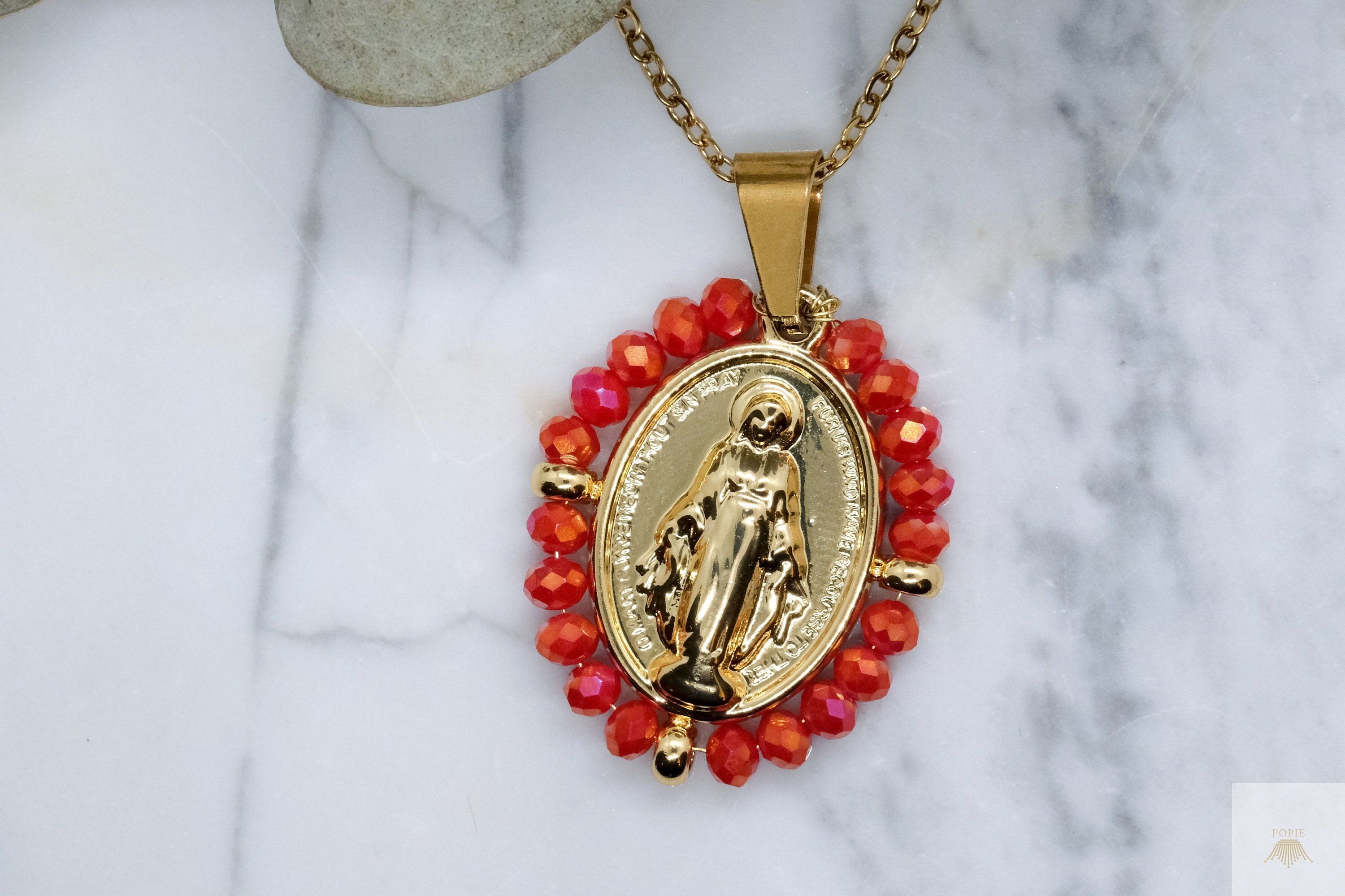 Our Lady stainless steel necklace surrounded by red organza beads