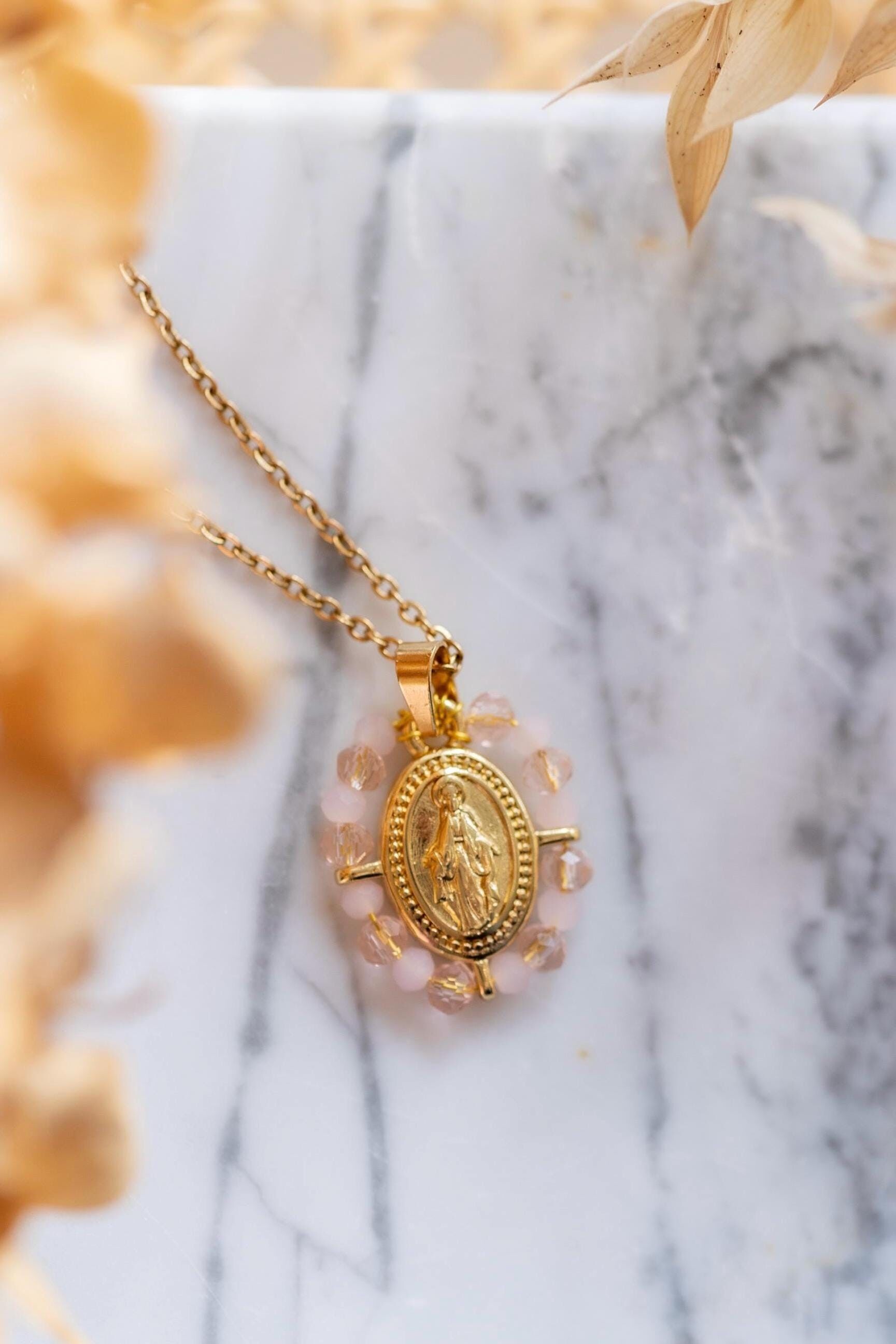 Our Lady stainless steel necklace, small model, surrounded by opaque and transparent pale pink pearls