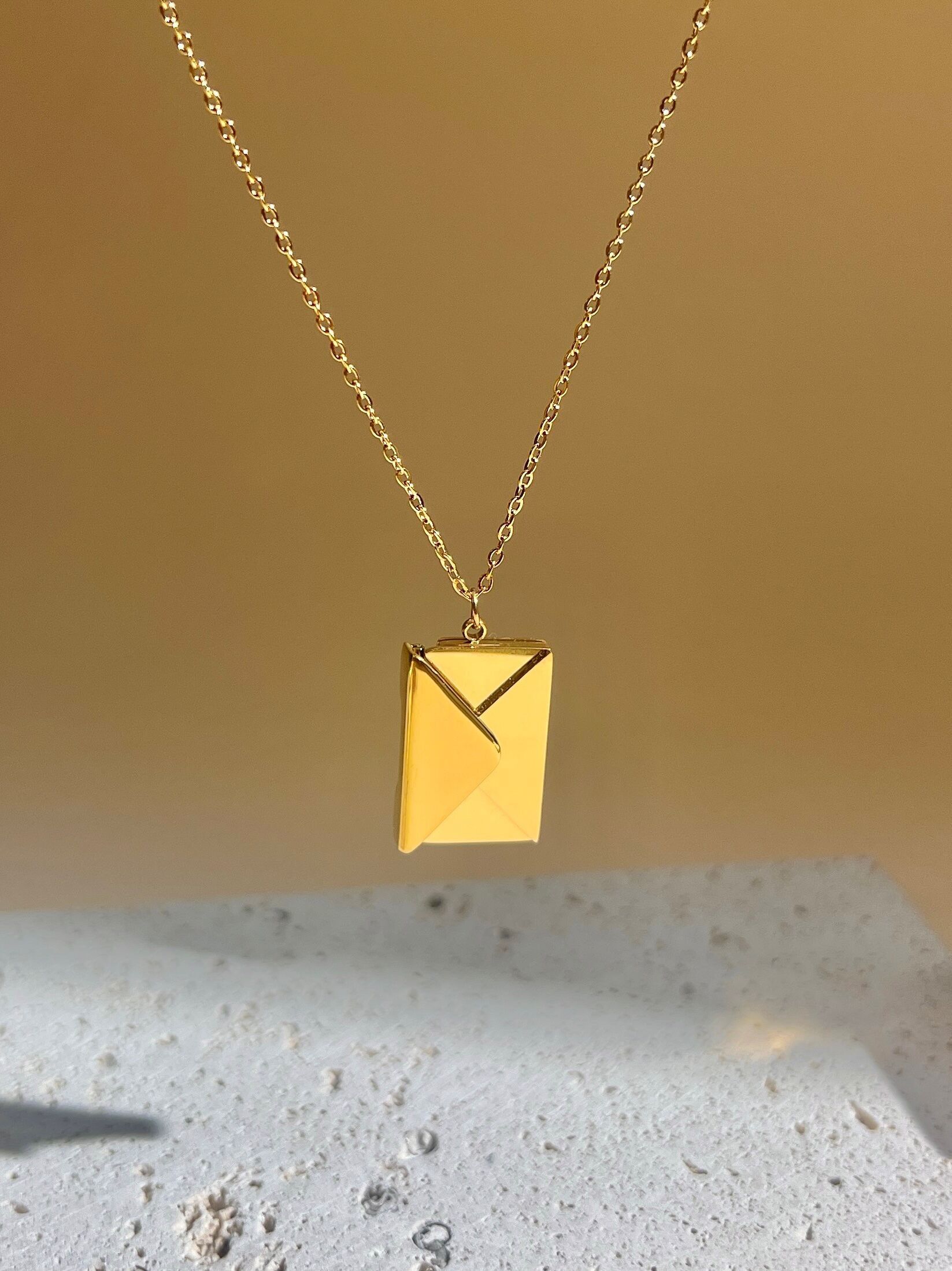 Stainless steel necklace with openable envelope pendant