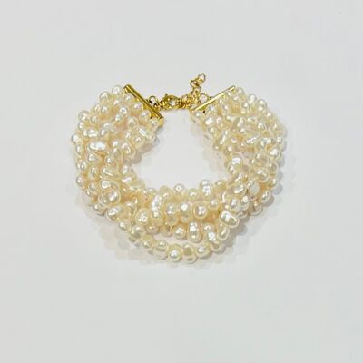 Pulsera de varias hileras con cuentas de resina de nácar y acero bañado en oro.