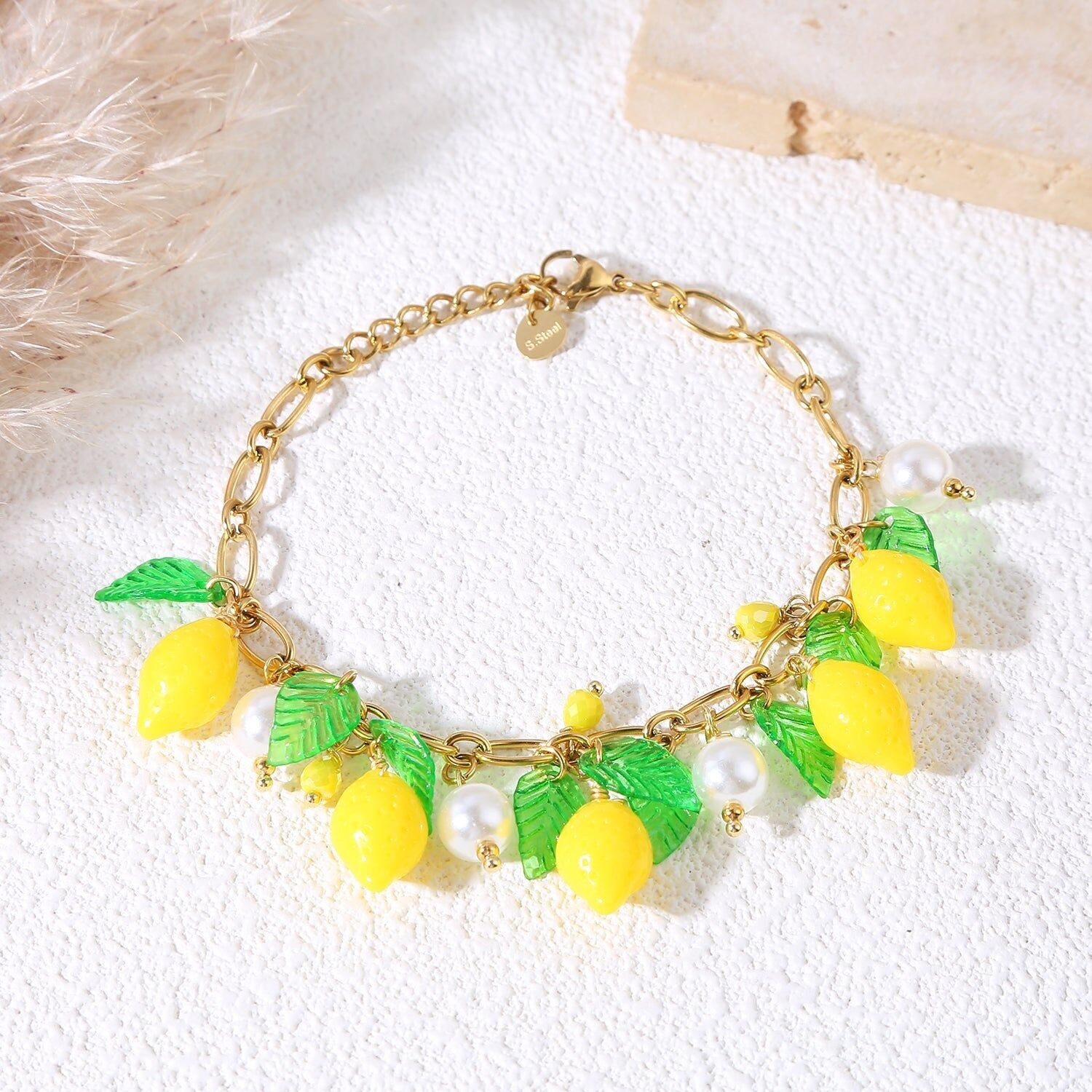 Bracciale a catena in oro con limoni e foglie
