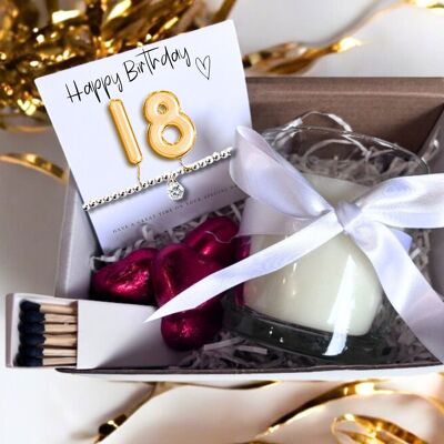 Cesta de regalo pequeña con globos dorados para 18.º cumpleaños: pulsera de circonitas, bombones y vela.