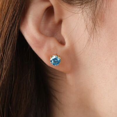 Orecchini a bottone con topazio blu in oro 9 carati