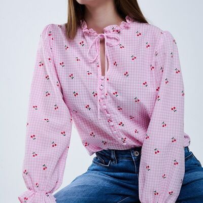Chemisier rose avec détails cerises et noeud noué