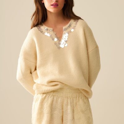Pull col V crème avec détails pailletés