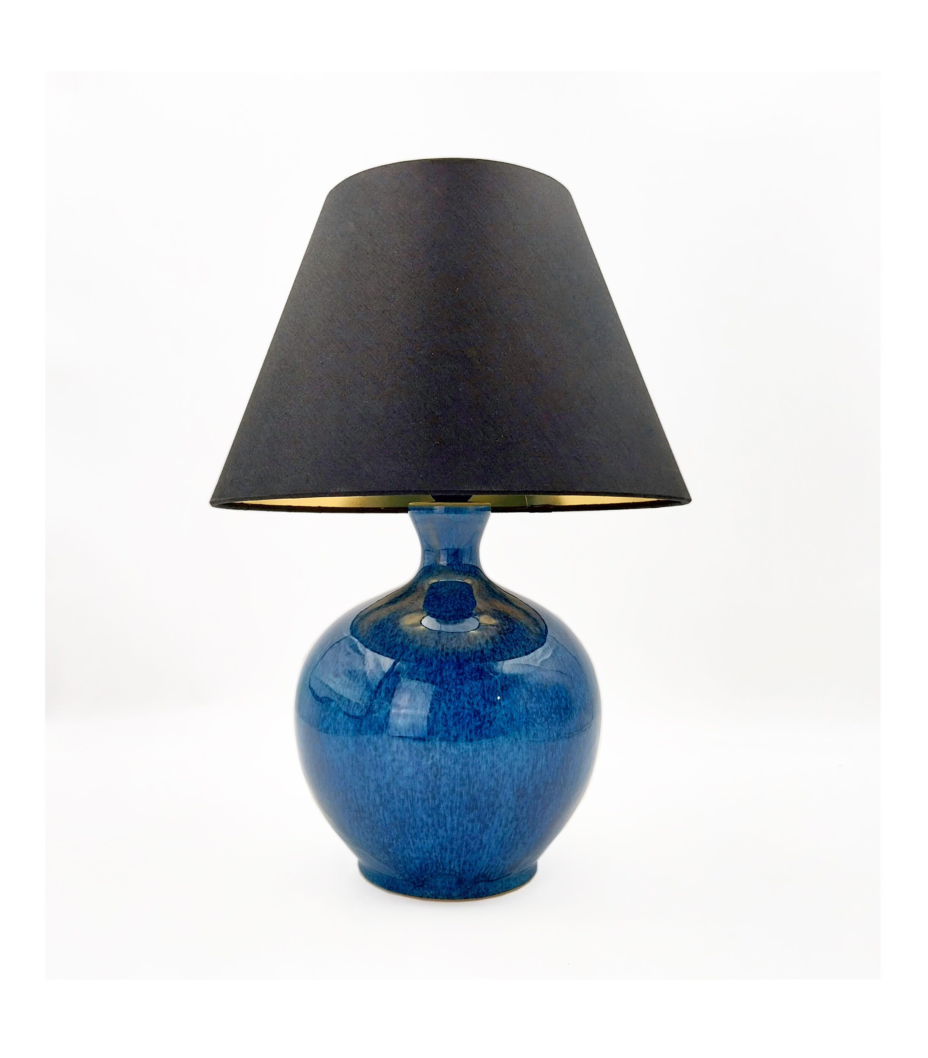 Deep Ocean Blue ceramic table lamp with Black & Gold Fabric Shade, unique color design, statement lamp. Very elegant.