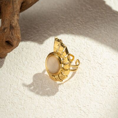 Anillo de acero inoxidable con concha en espiral y piedra de ojo de gato