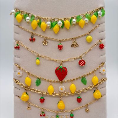 Set of 6 fruit necklaces on display