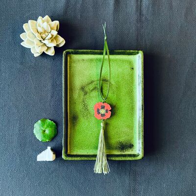 Decoración con borlas de amapola