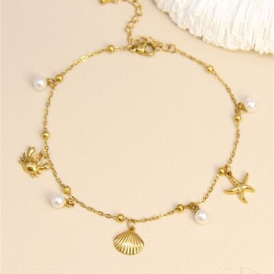 Chaîne de cheville dorée – Breloques marines & perles blanches